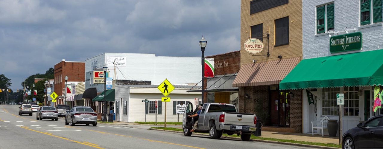 Historic downtown Murfreesboro, North Carolina, with brick storefronts and a Historic District sign
